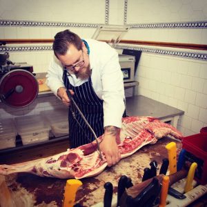 Cutting meat at Bishops, Uckfield